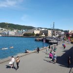 people walking on a city warf